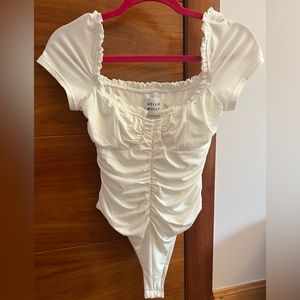 Hello molly ruffled bustier body suit. Worn once and dry cleaned. US size 6.